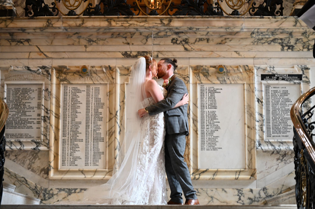 Couple kissing on Marble Staircase at Stockport Town Hall